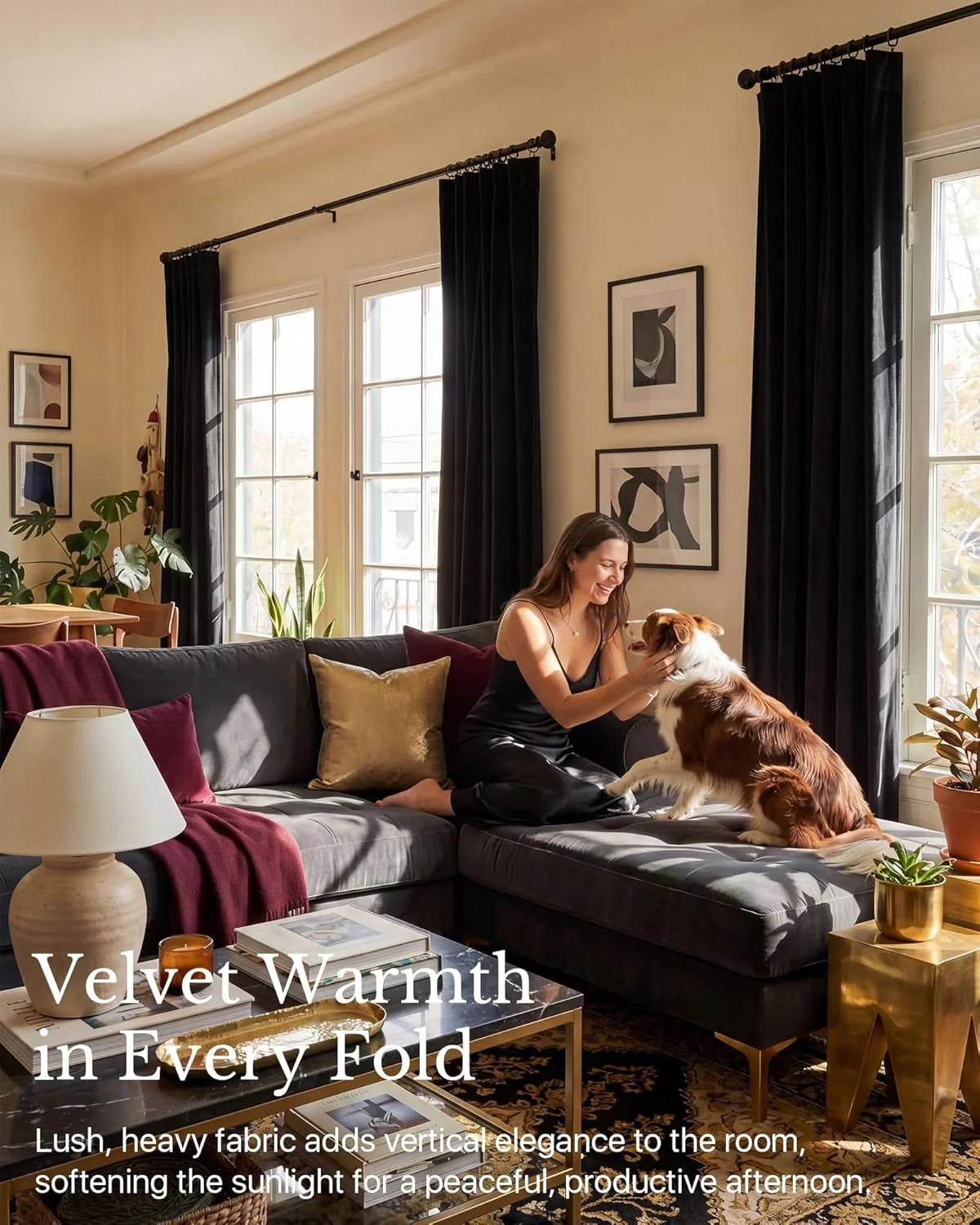 Black velvet curtains framing tall windows in a warm modern living room with sofa