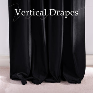 Rich black velvet drapes with elegant folds, pooling onto a light beige carpet for a luxurious look.
