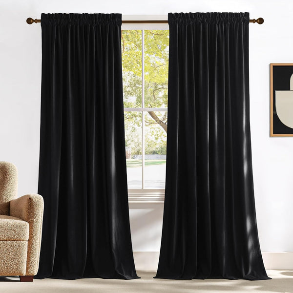 Black velvet pencil pleat curtains hanging on a bronze rod, ideal for room darkening.