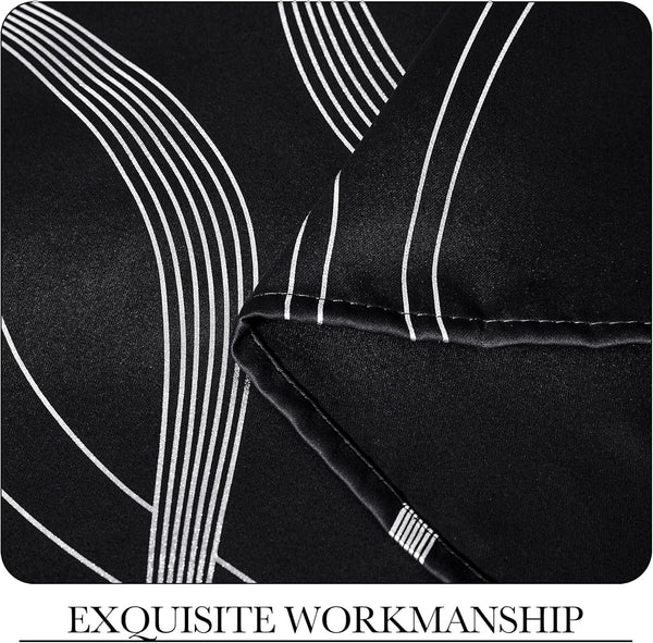 Close-up of black fabric with shiny white art deco geometric lines. Shows precise stitching and quality workmanship.