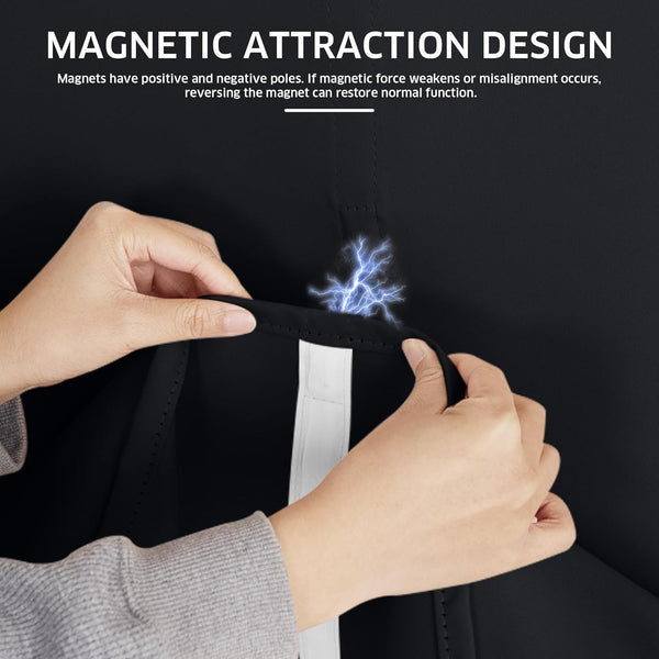 Hands demonstrating magnetic closure on a black blackout curtain, showing the attractive force.