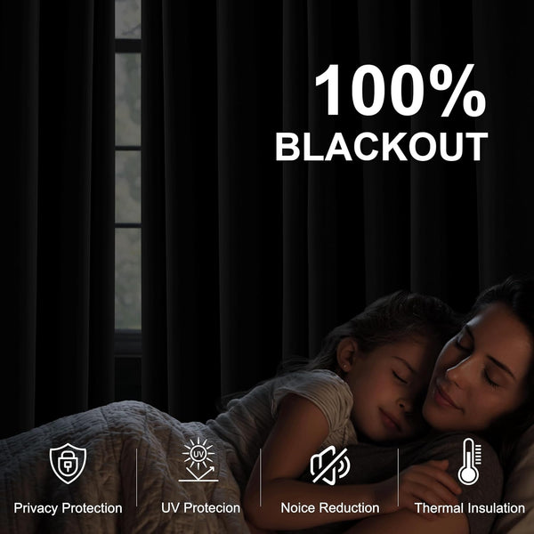 Solid dark blackout curtains completely cover a window, creating a dark, quiet room for comfortable sleep.