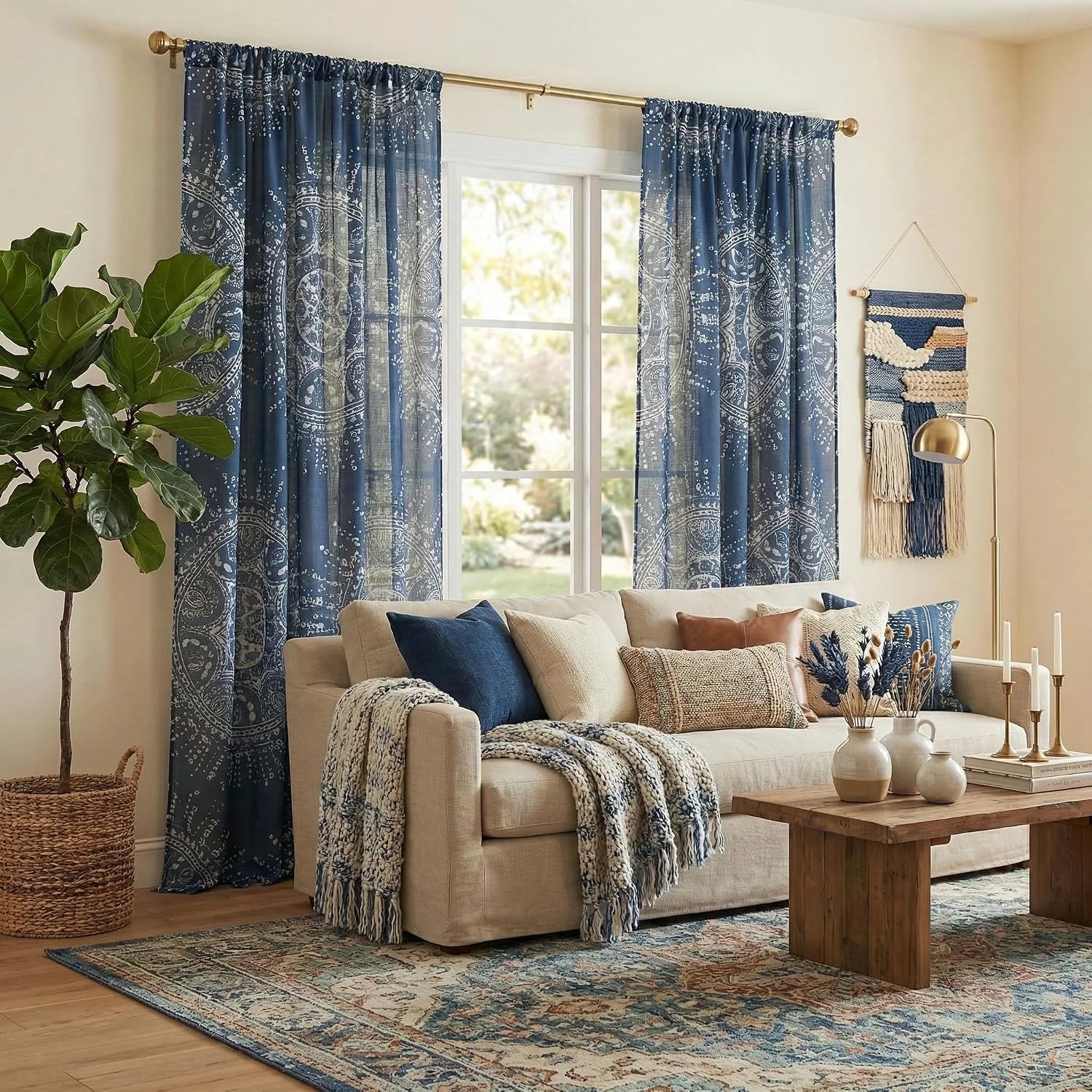 Blue patterned sheer curtains over a window in a cozy boho living room