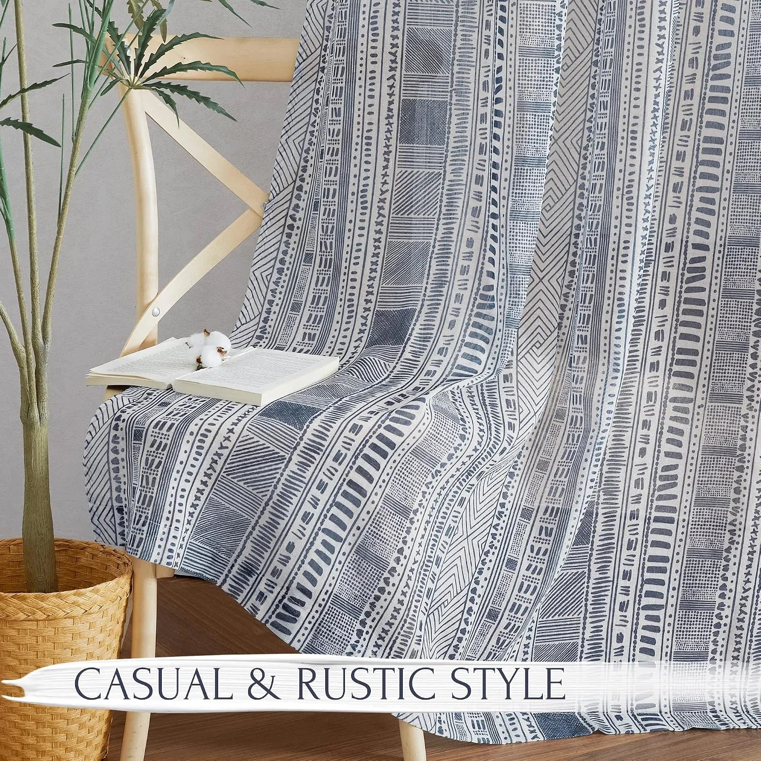 Blue and white boho striped cotton throw draped over a wooden ladder chair
