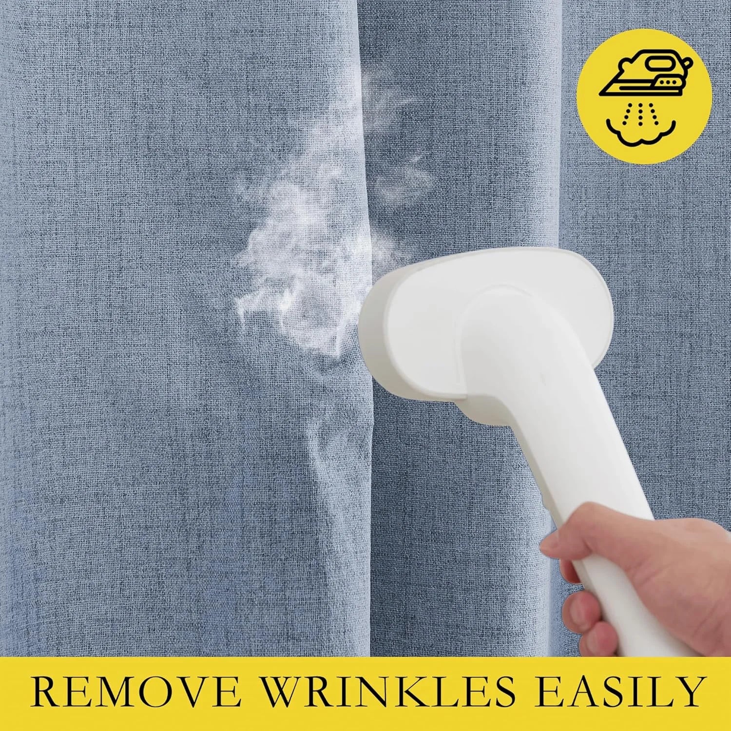Handheld steamer removing wrinkles from a light blue textured curtain panel