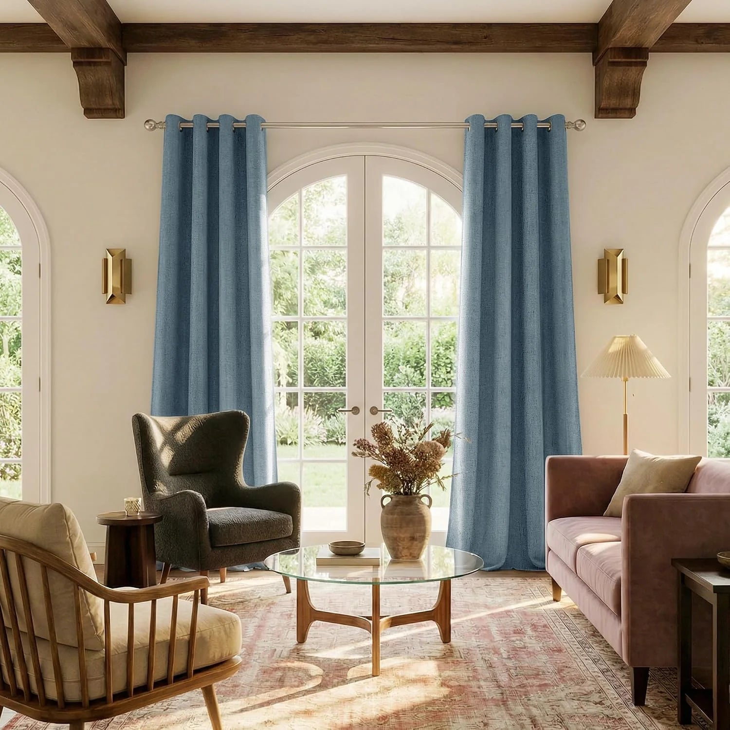 Light blue linen-look grommet curtains framing arched French doors in a cozy living room