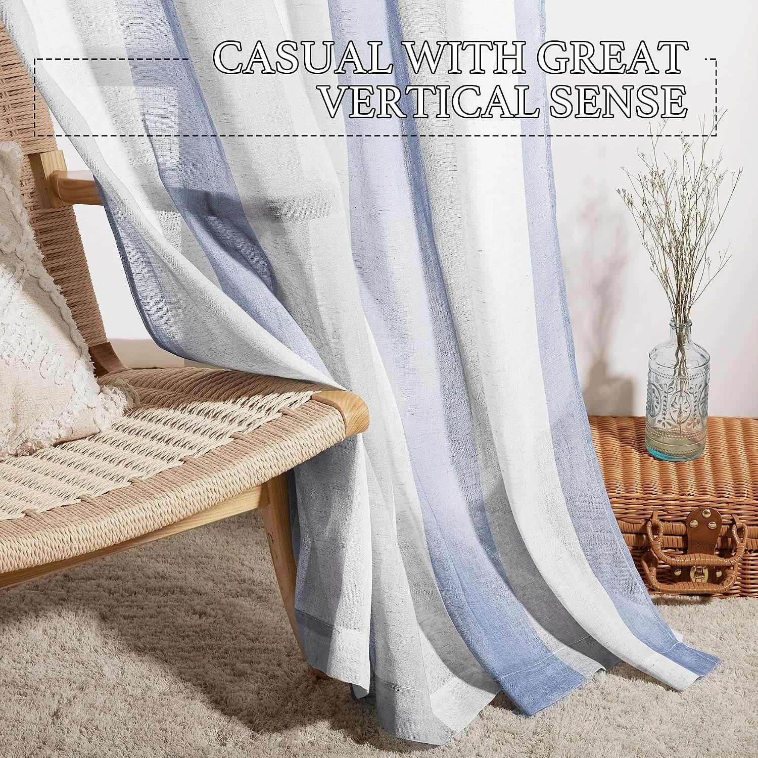 Blue and white sheer linen curtain draped in a cozy room beside woven furniture