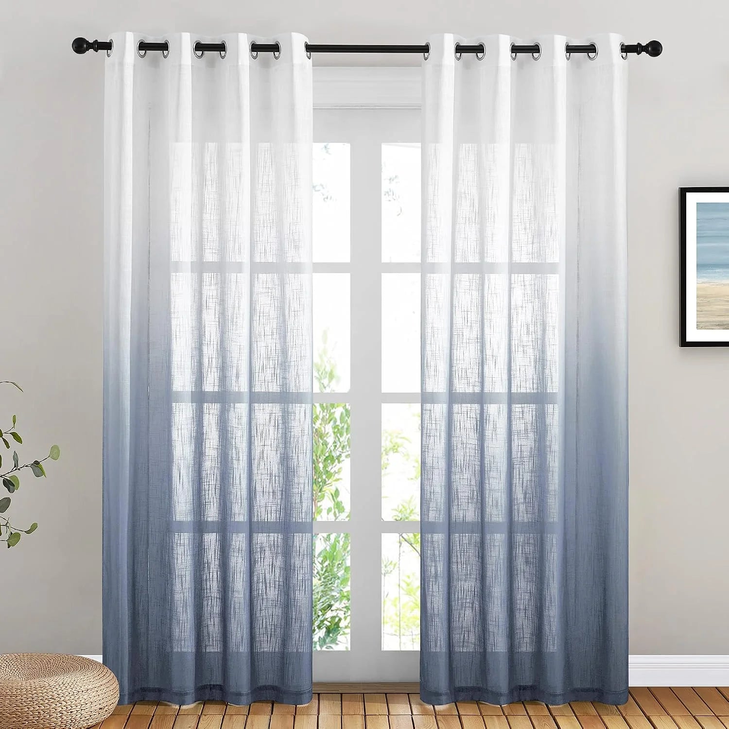 White to blue ombre sheer linen curtains with grommet top on a black rod