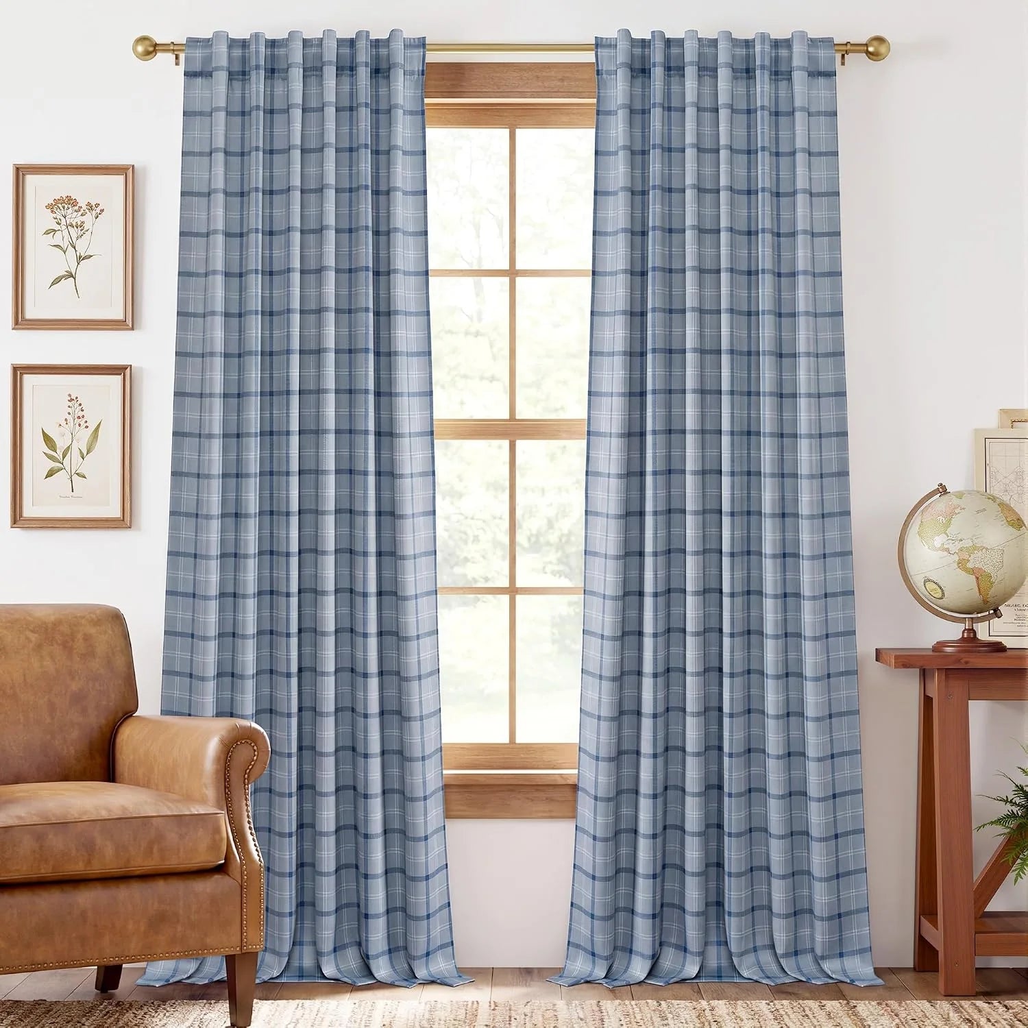 Light blue plaid curtains on a brass rod in a cozy farmhouse living room