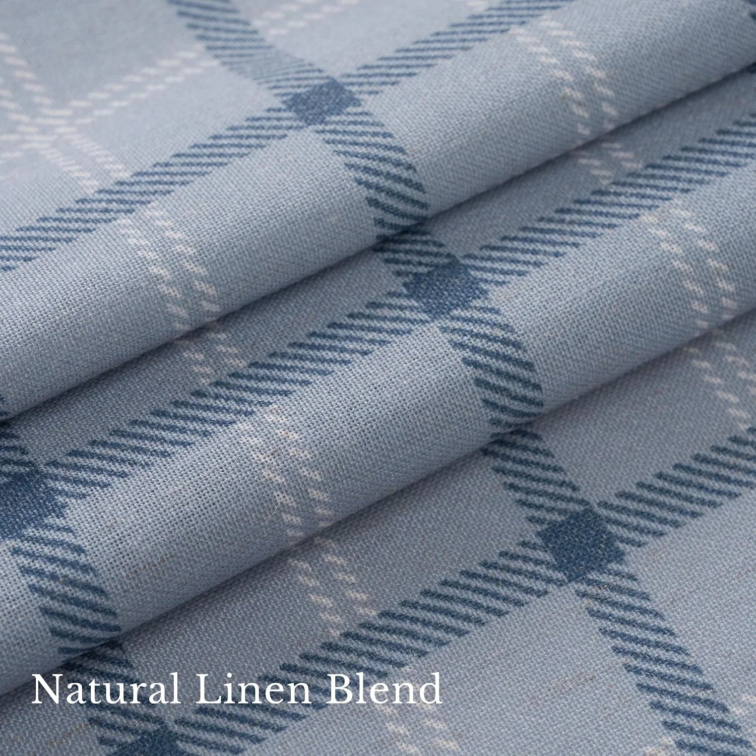 Close-up of soft blue plaid linen blend fabric with folded texture detail