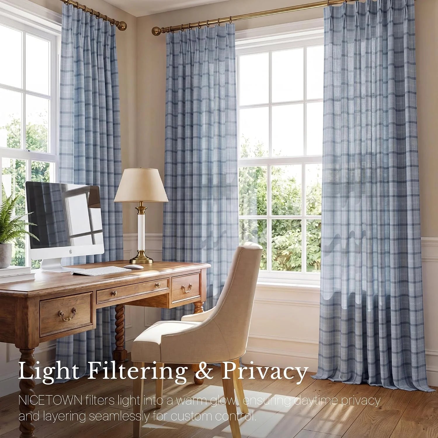 Light blue plaid sheer curtains hanging in a bright home office with wooden desk