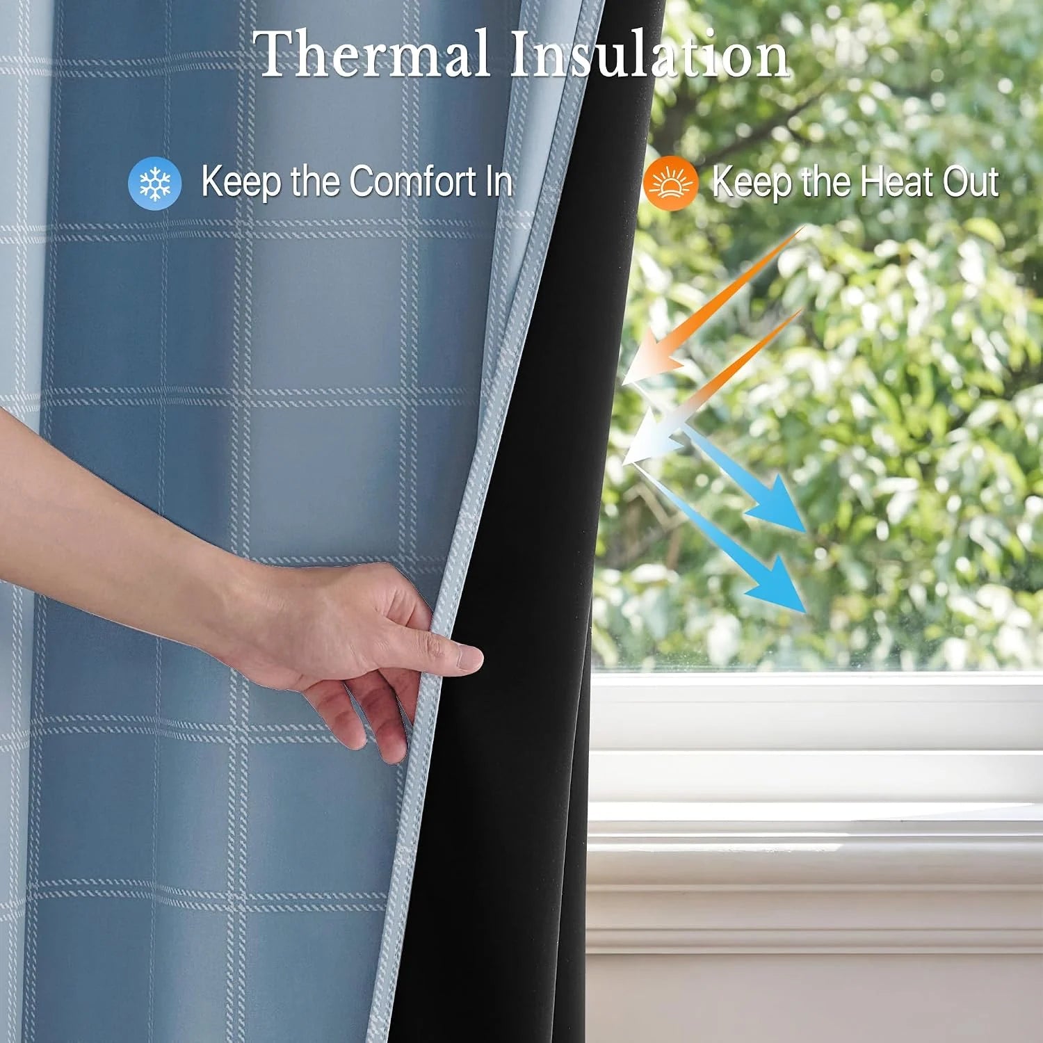 Hand holding blue plaid thermal blackout curtain with black insulated backing by window