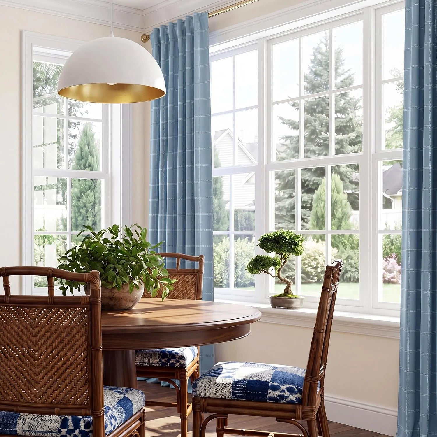 Light blue plaid curtains framing large windows in a bright dining room