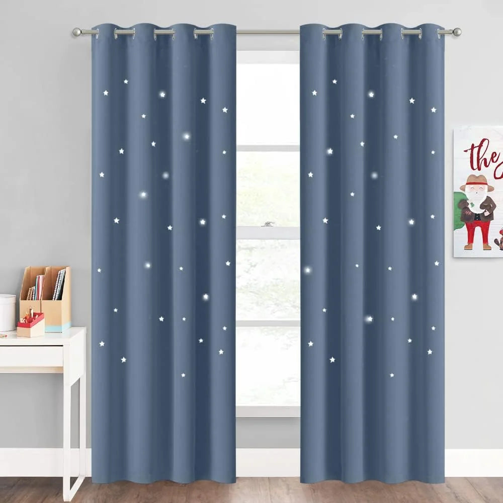 Blue blackout curtains with white star pattern and silver grommets in a kids room