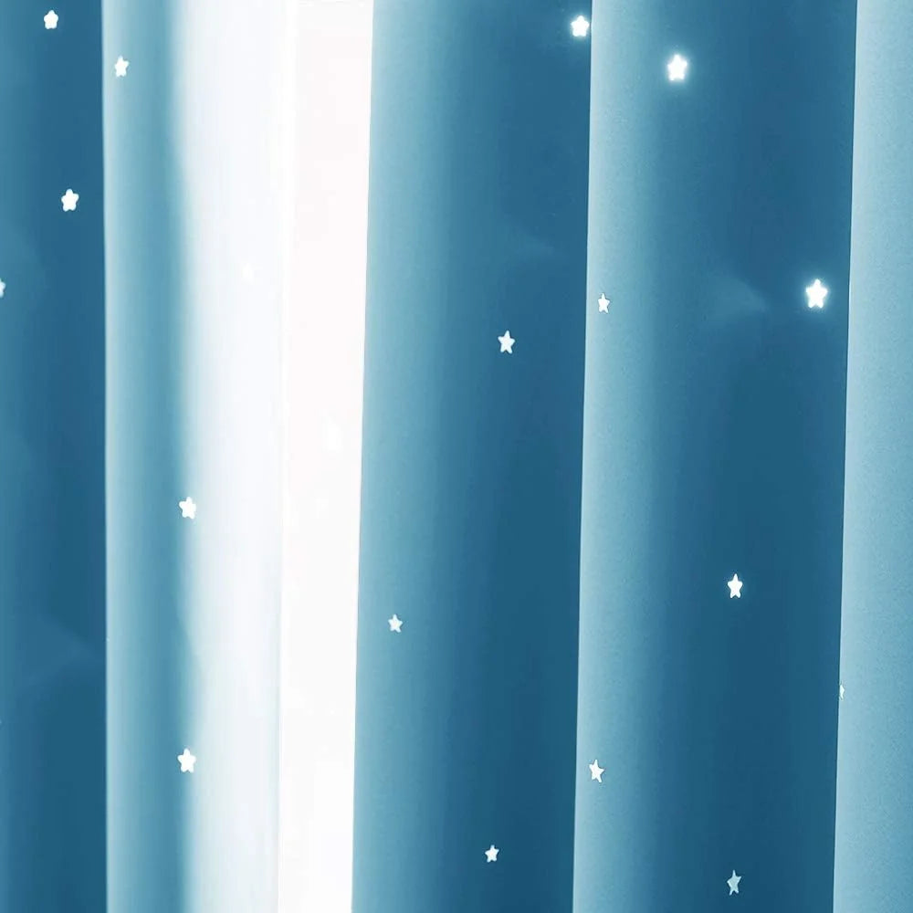Blue blackout curtain with small white star pattern and soft folded fabric