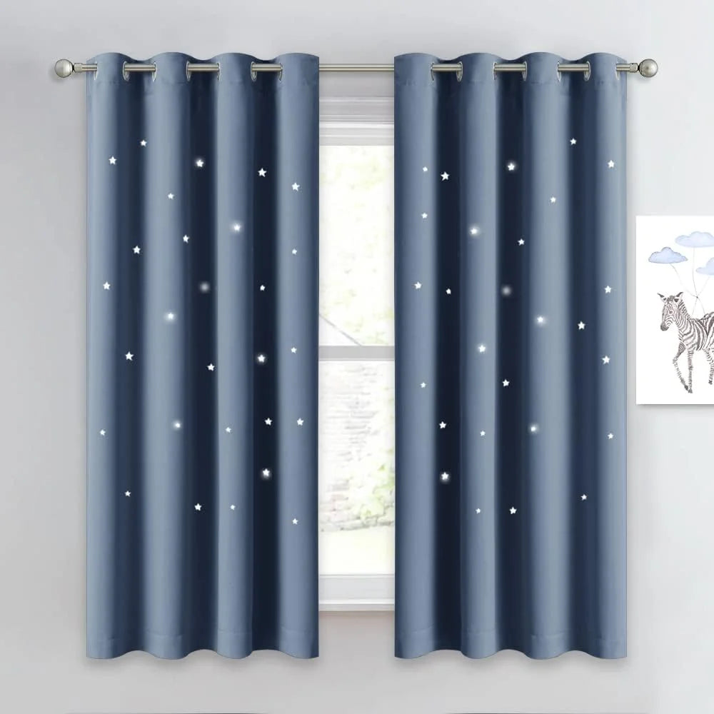 Blue grommet curtains with scattered white star print hanging on a silver rod