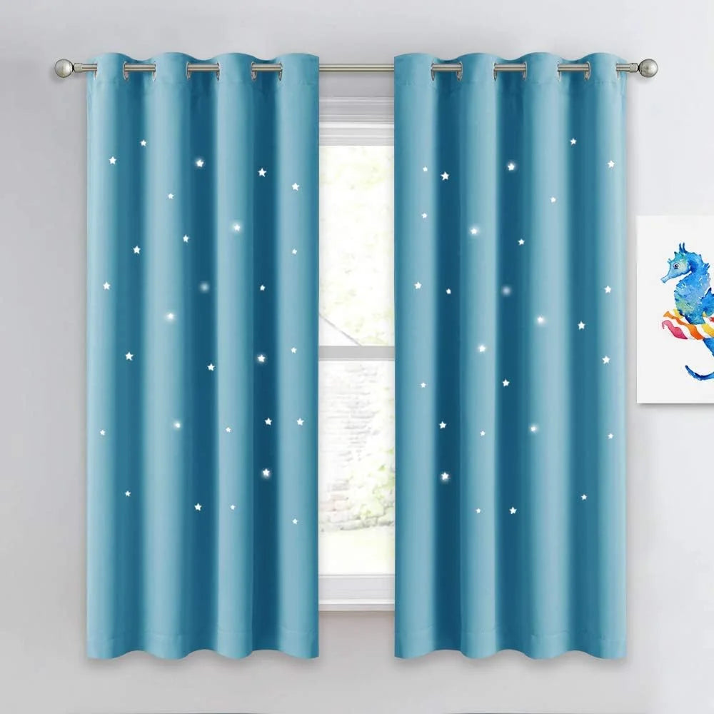Sky blue curtains with white star print and silver grommets on a window