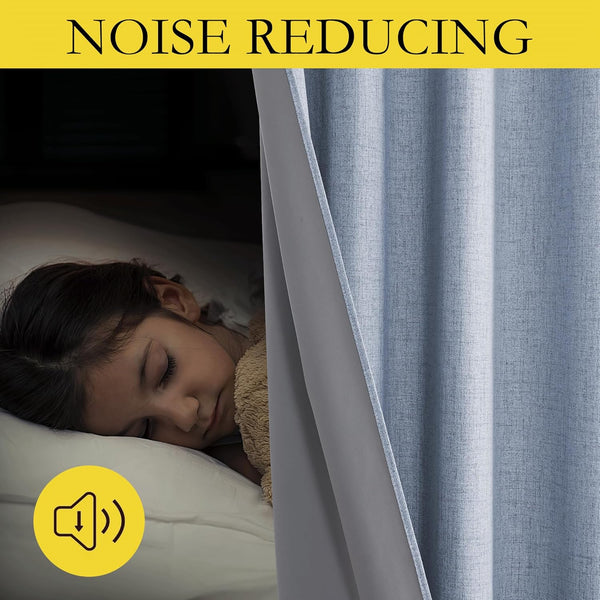 Blue textured noise reducing blackout curtains with grey lining. Child sleeps soundly in dark room.