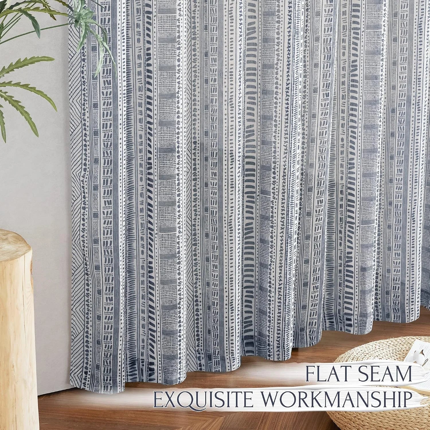 Blue and white boho patterned curtain panel with flat seam detail in a bright room