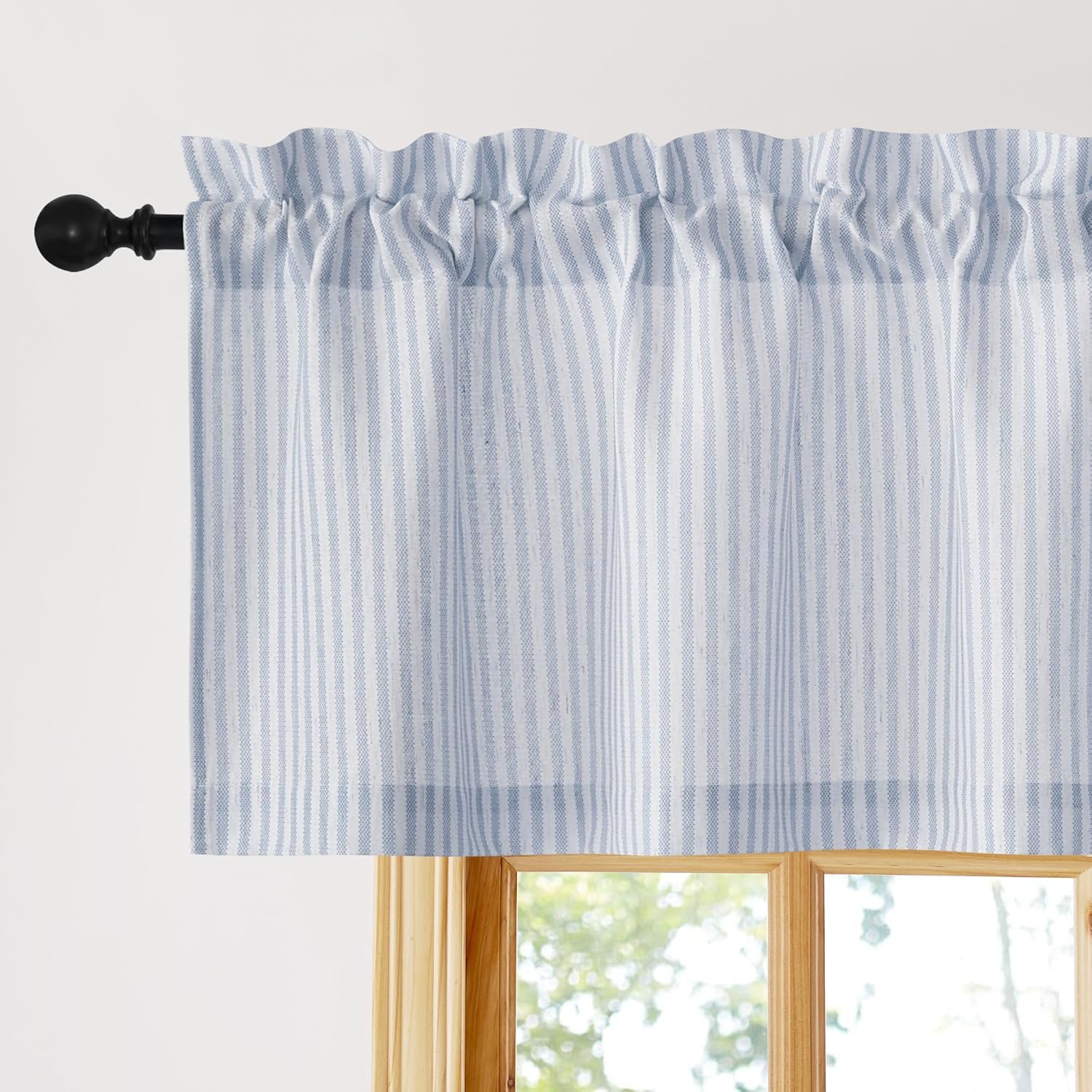 Light blue and white vertical striped cotton valance with gathered rod pocket top, on a black rod.