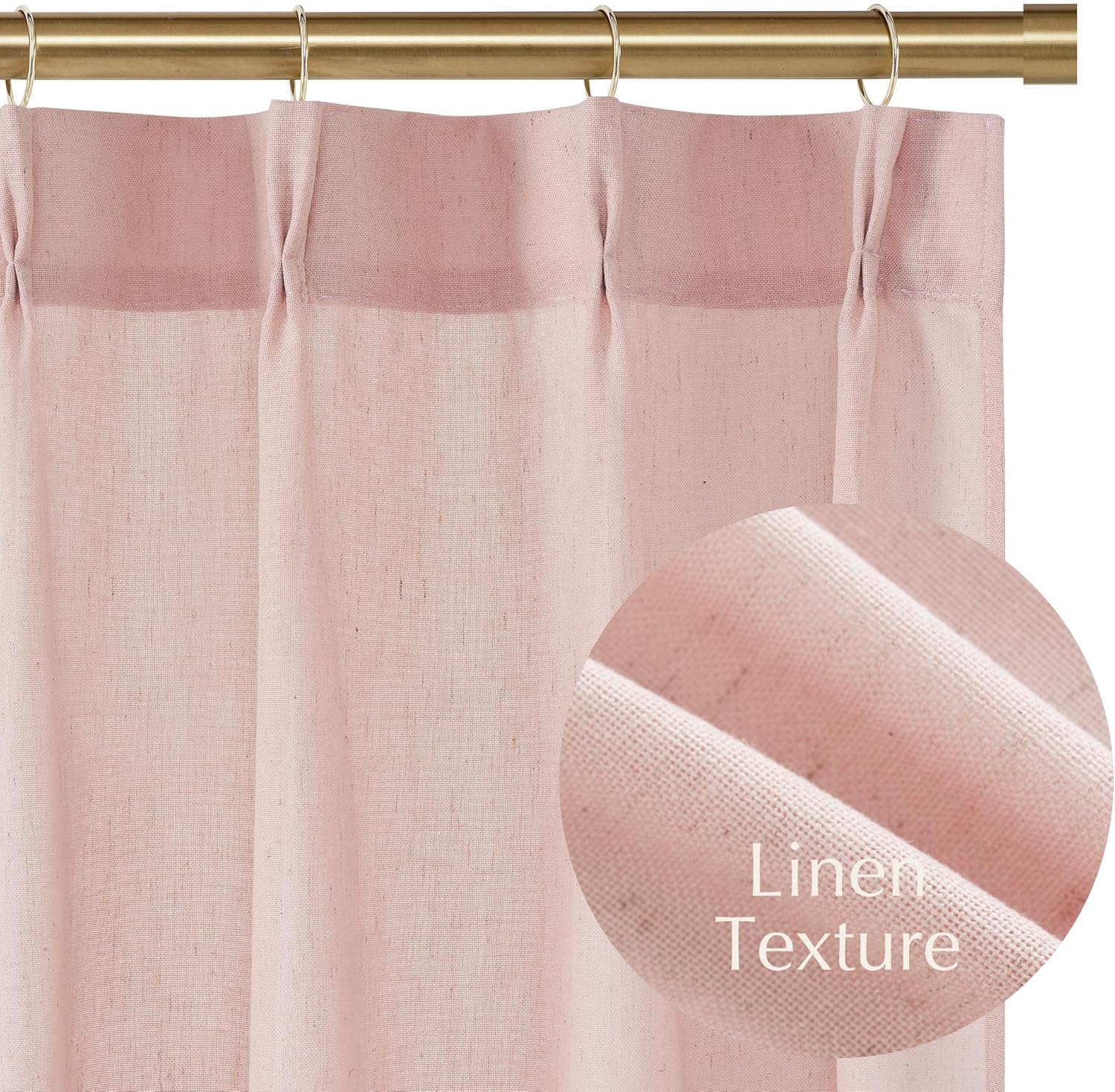 Textured blush pink linen pinch pleat curtain on a golden curtain rod with rings.