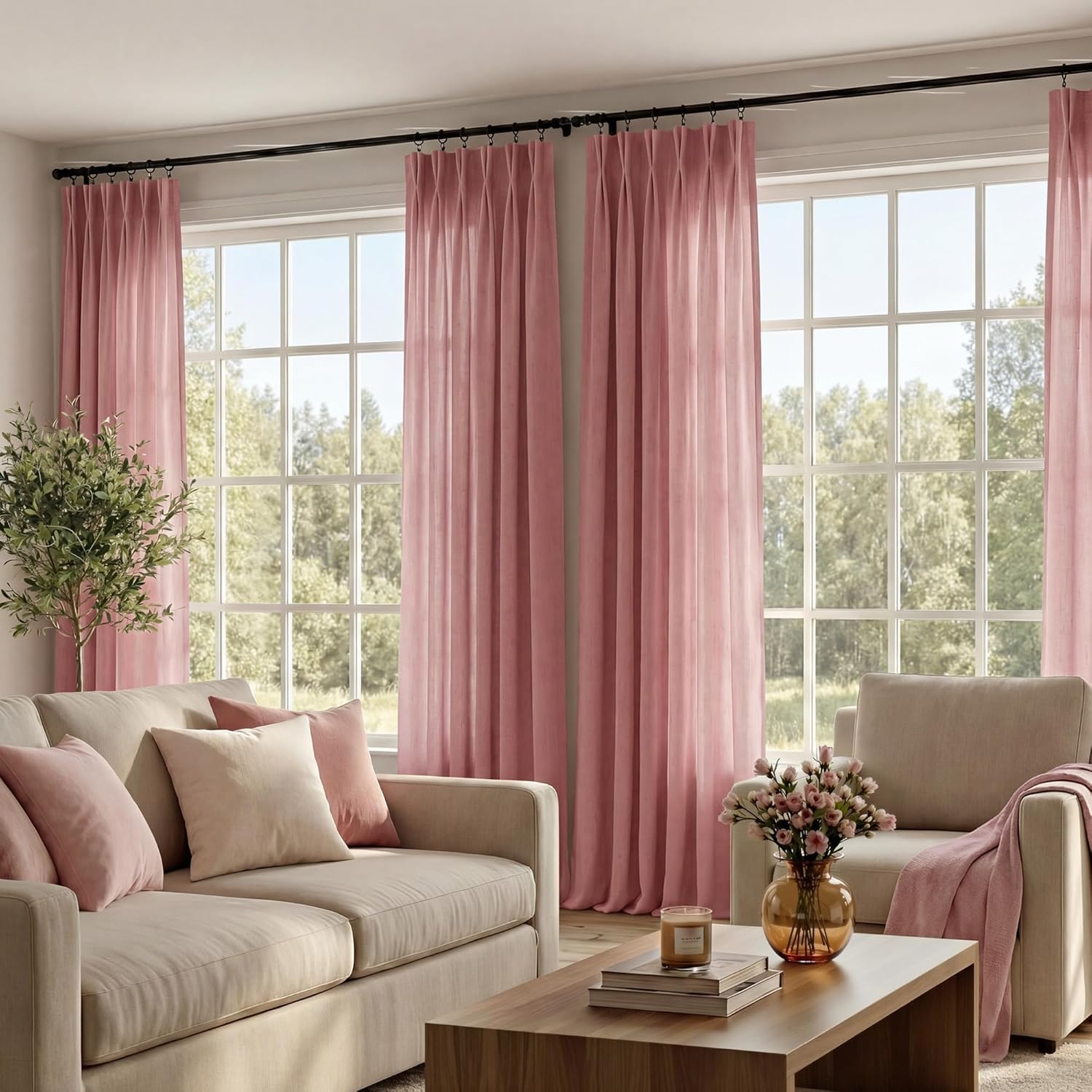 Floor-length blush pink linen curtains with elegant pinch pleats on a black rod, enhancing a bright living room.