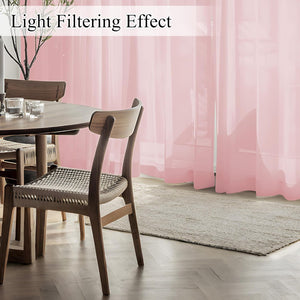Blush pink sheer light filtering curtains gently illuminate a modern dining room.