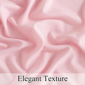 Close-up of blush pink smooth fabric with elegant soft folds and gentle sheen