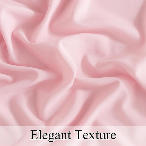 Close-up of blush pink smooth fabric with elegant soft folds and gentle sheen