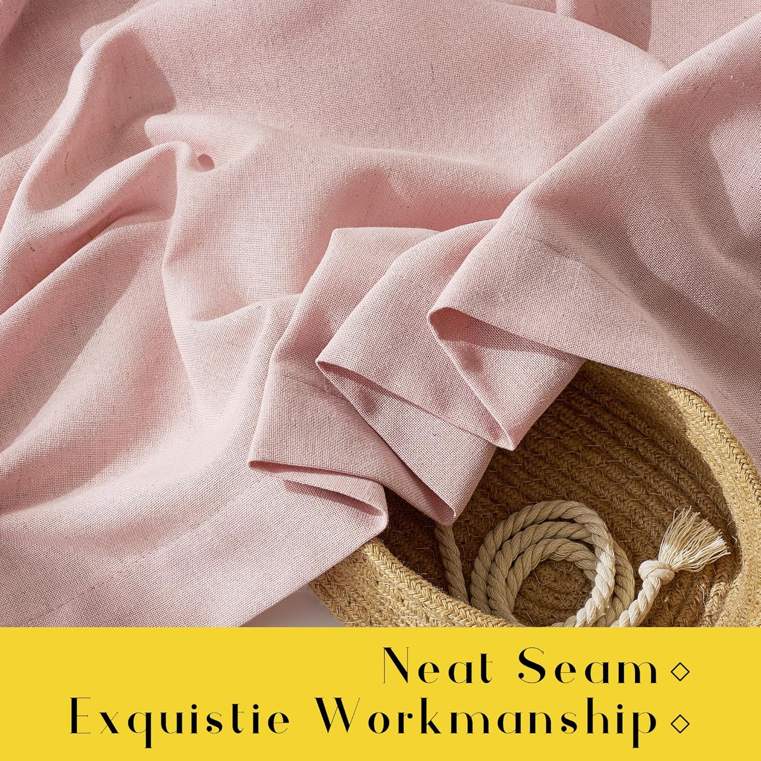 Soft blush pink textured linen-look fabric with a neat seam, draped over a straw basket.