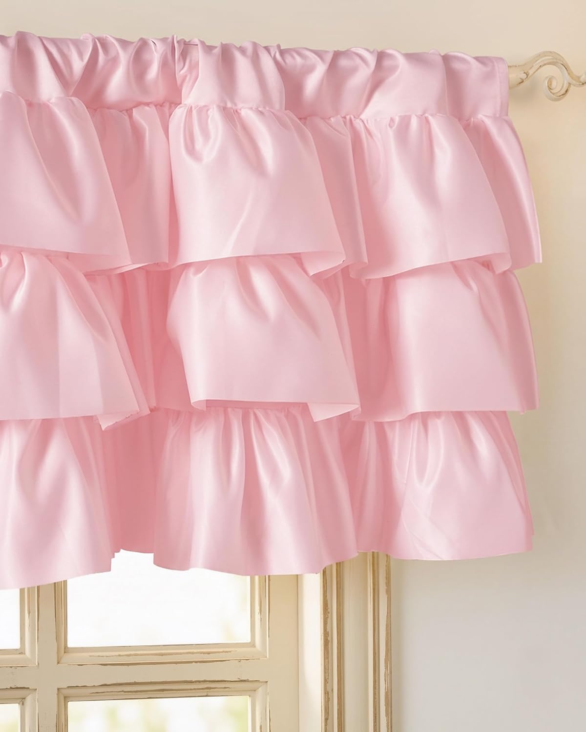 Blush pink tiered ruffle window valance with a soft, satiny finish, gathered at the top.