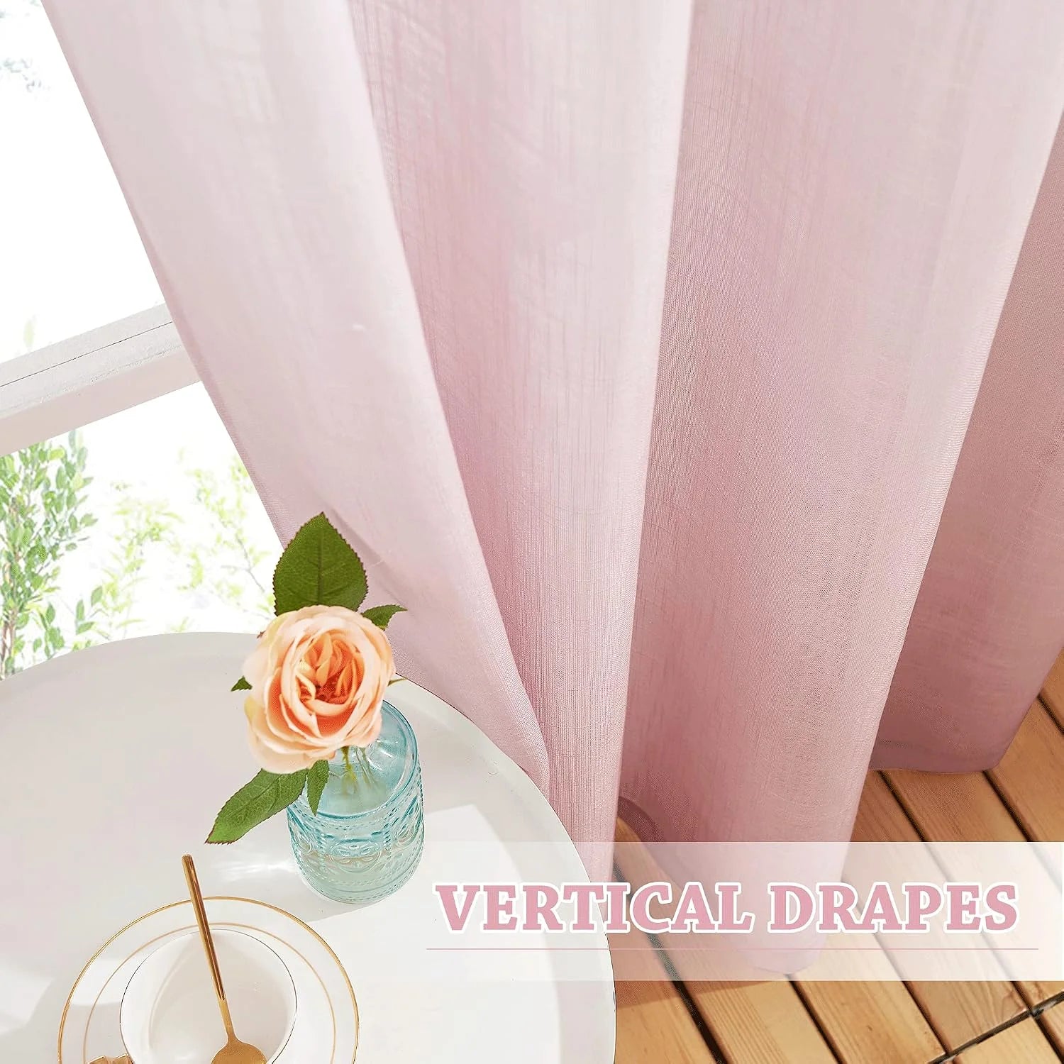 Blush pink sheer curtains with soft vertical drape beside a bright window and side table