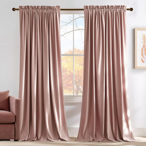 Blush velvet rod pocket curtains hanging on window, puddling on floor. Matching sofa visible.