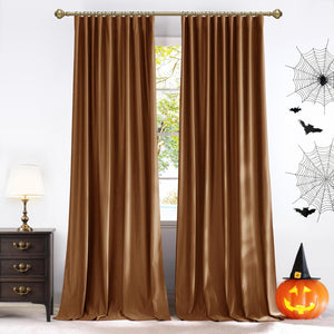 Luxurious bronze brown velvet curtain panels with pleated tops, hung on a gold rod.
