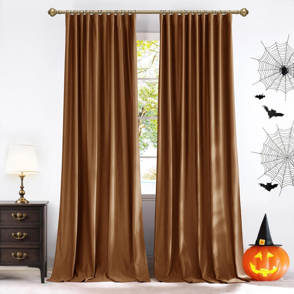 Luxurious bronze brown velvet curtain panels with pleated tops, hung on a gold rod.