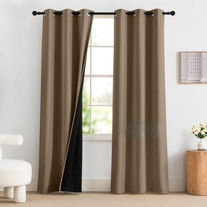 Brown blackout curtains with grommet tops, revealing a black lining, hung on a rod in a bright room.