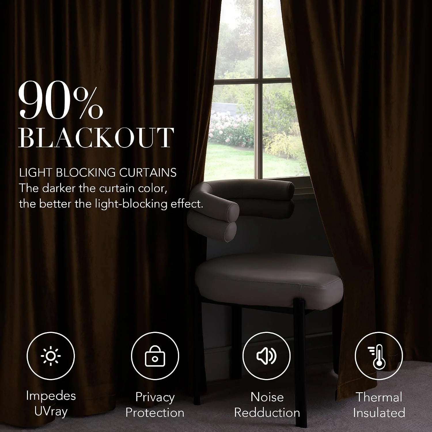 Dark brown blackout curtains framing a window beside a cushioned chair
