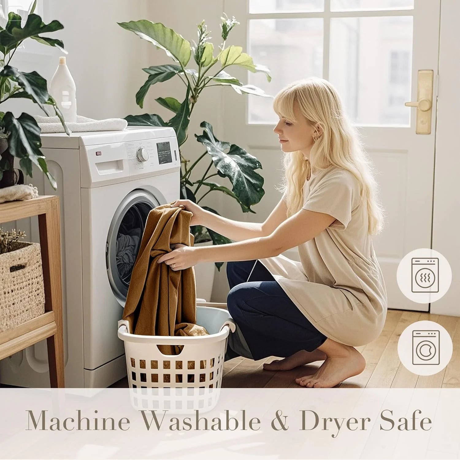 Woman loading a brown fleece blanket into a washing machine in a bright laundry room