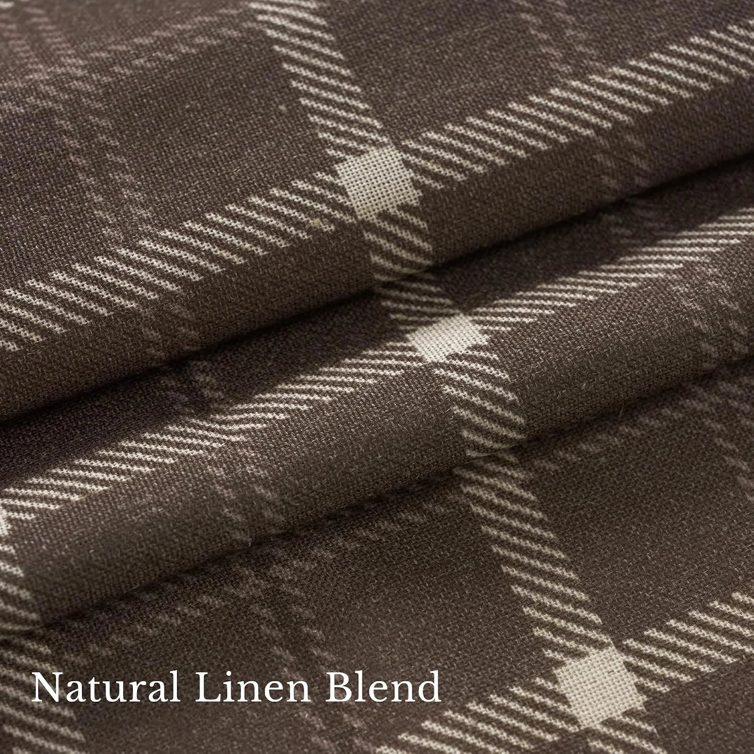 Close-up of brown linen blend fabric with cream plaid pattern and soft woven texture