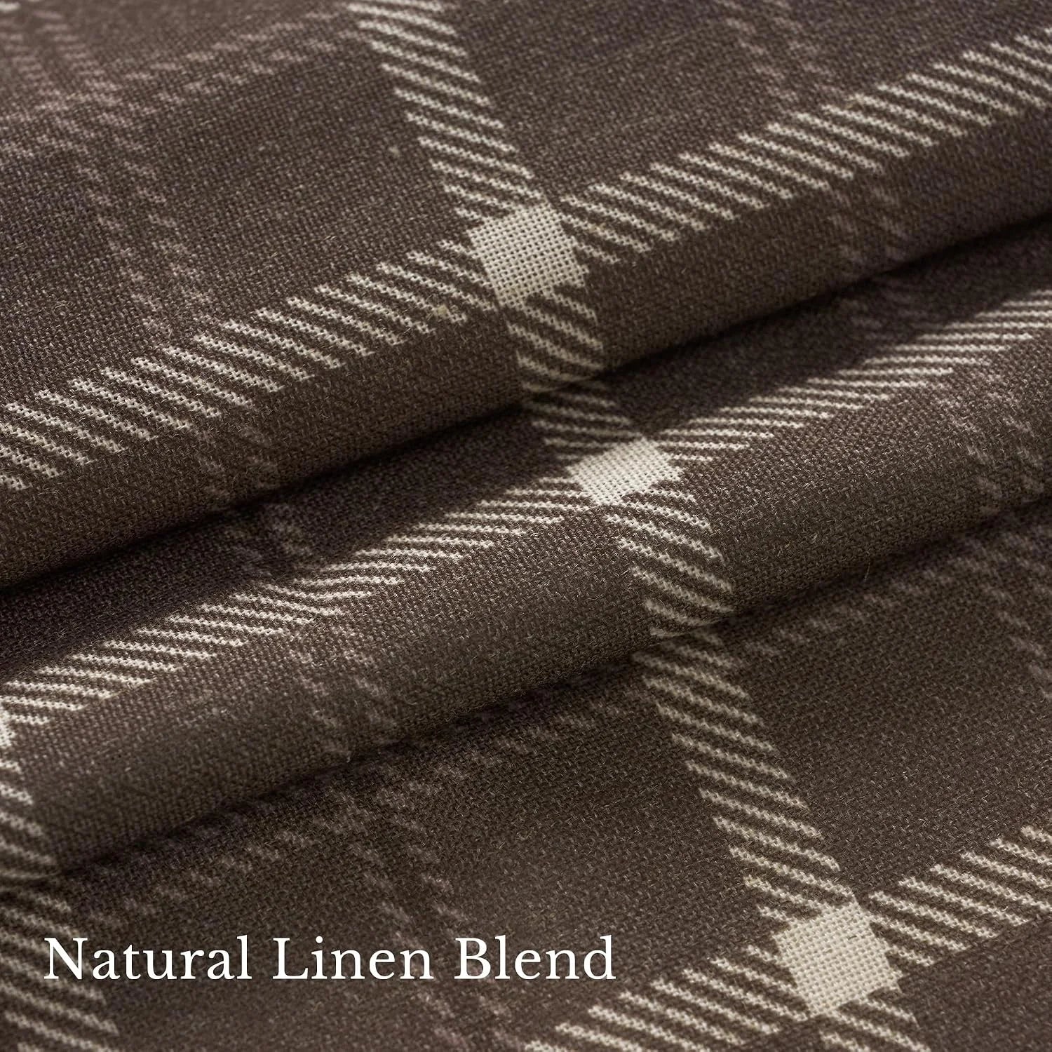Brown linen blend fabric with cream plaid pattern shown in a folded close-up