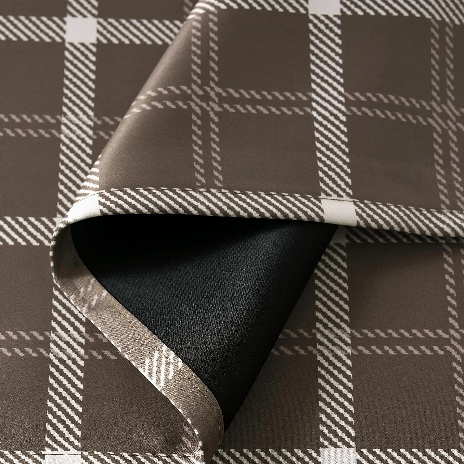 Brown plaid curtain fabric with white windowpane pattern and black blackout backing