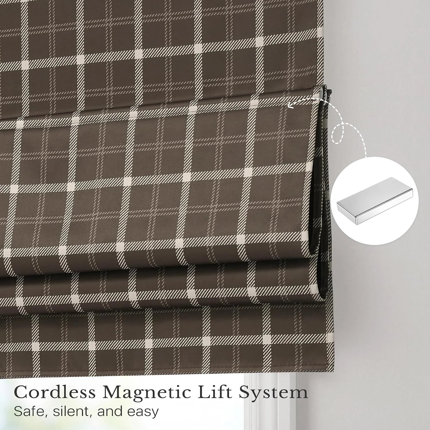 Brown plaid cordless Roman shade with magnetic lift system on a light wall