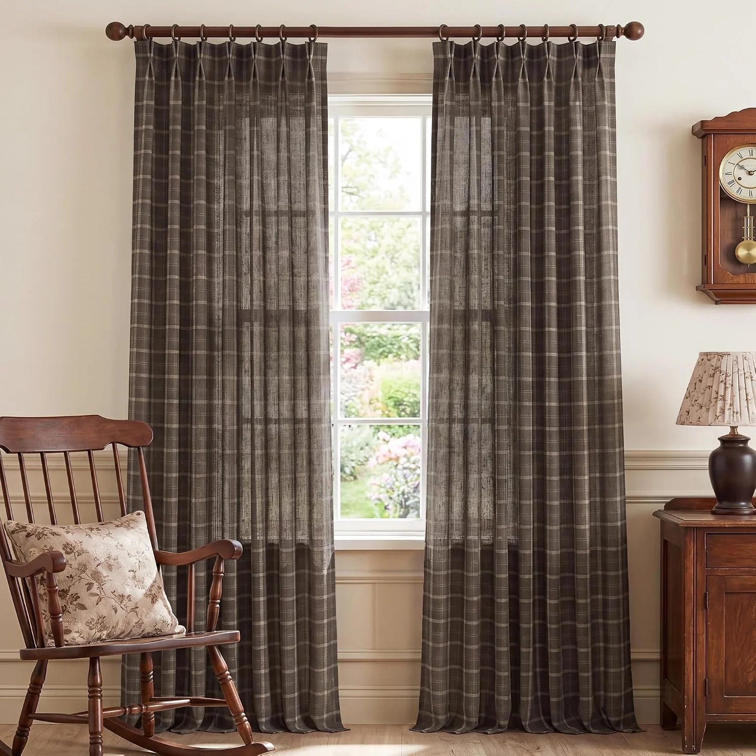 Brown plaid sheer curtains on a wooden rod in a traditional room with wood furniture