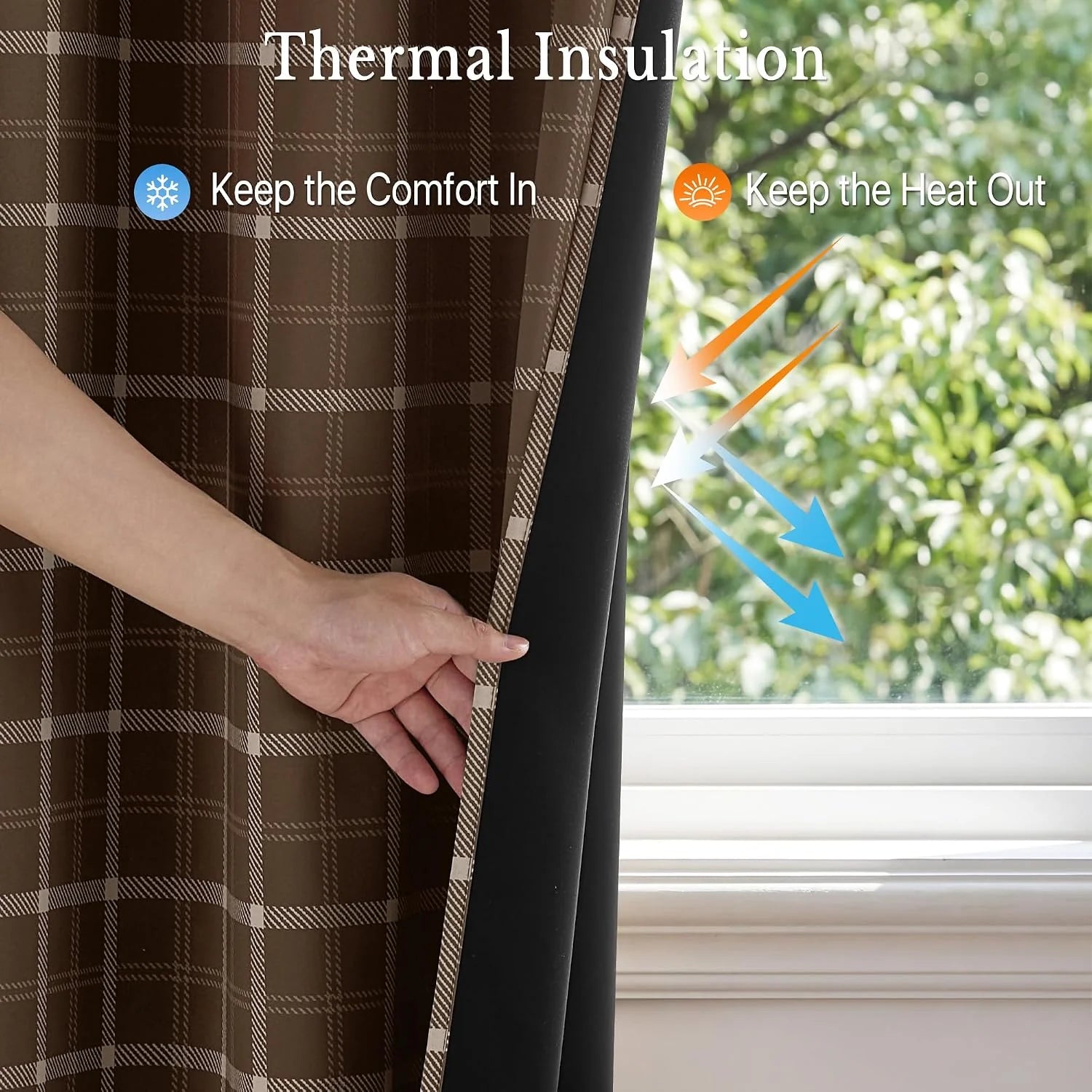 Hand pulling back a brown plaid thermal blackout curtain beside a sunny window