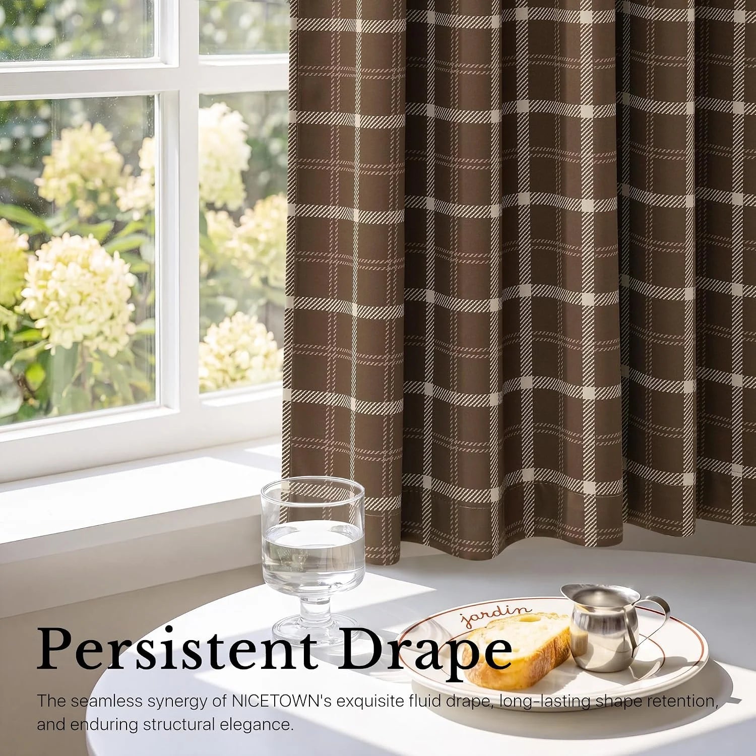 Brown plaid curtain panel beside a bright window with a breakfast table setting