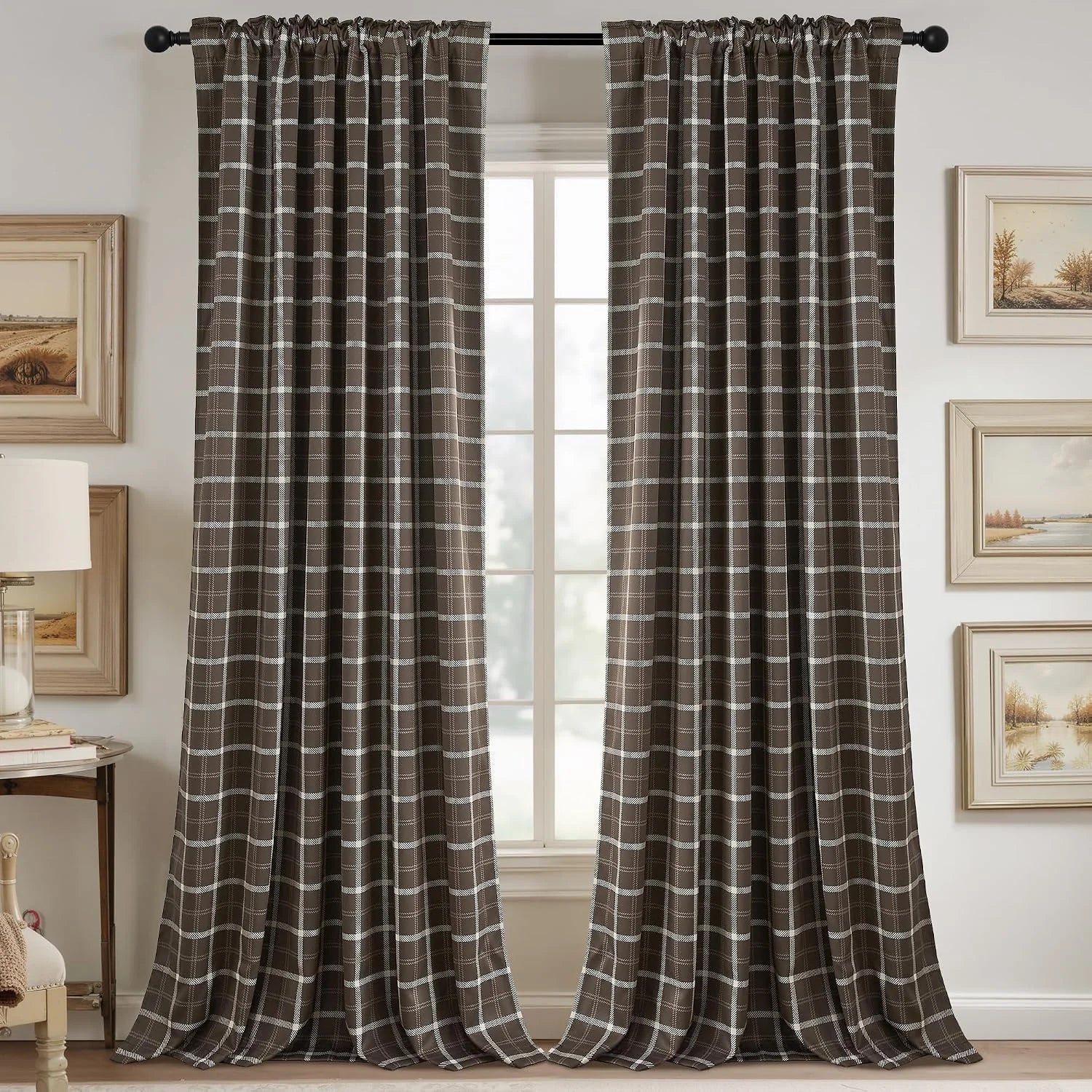 Brown plaid curtains with white grid pattern hanging on a black rod by a window