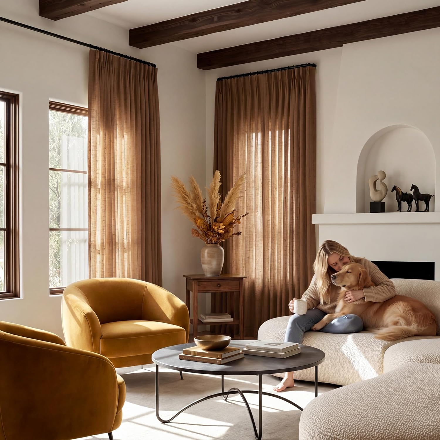 Brown sheer linen pinch pleat curtains hanging in a sunny modern living room.