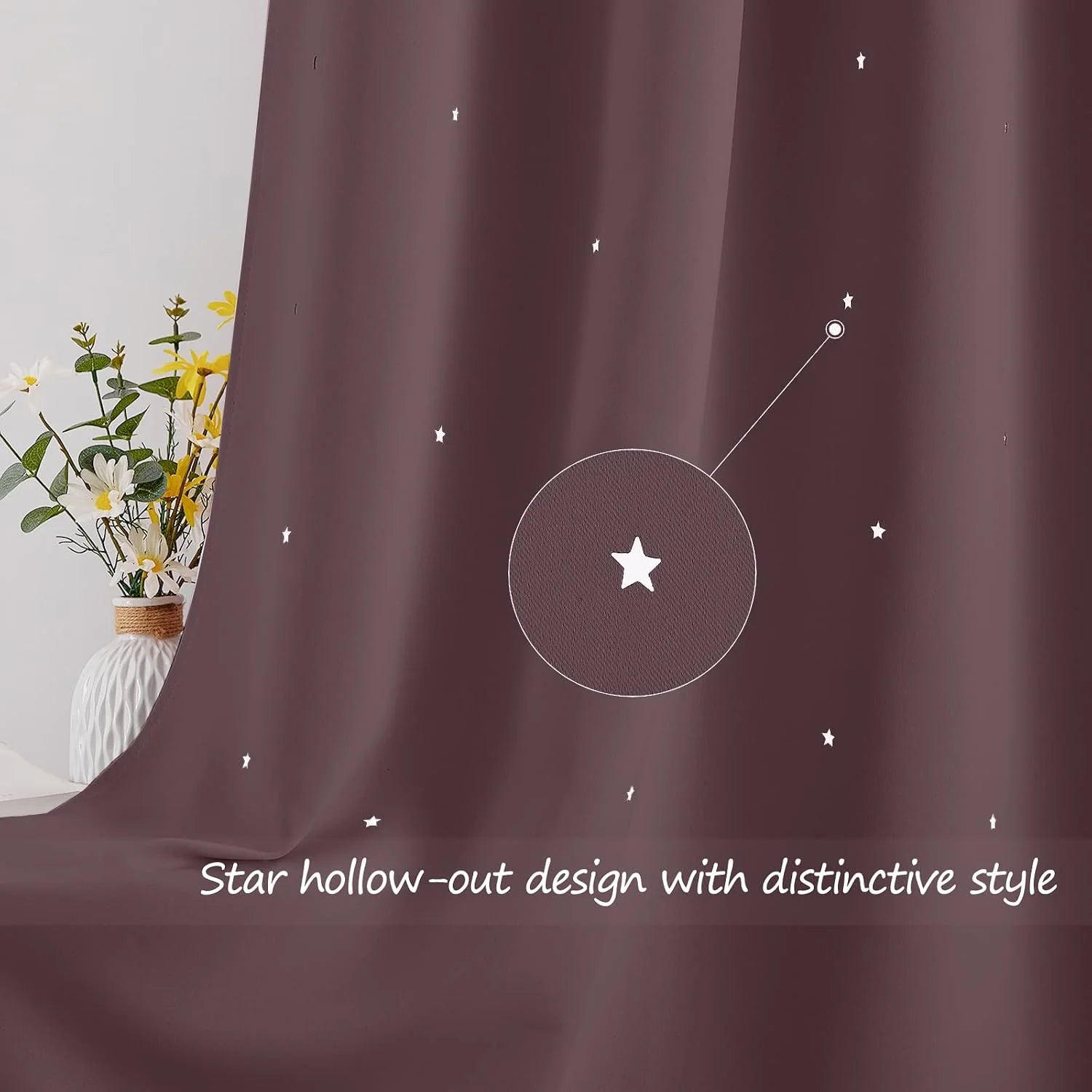 Brown curtain with small star cutout pattern beside a white vase of flowers