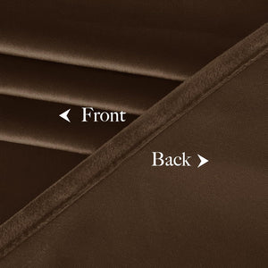 Close-up of brown blackout curtain fabric, showing its soft velvet front and tightly woven back.