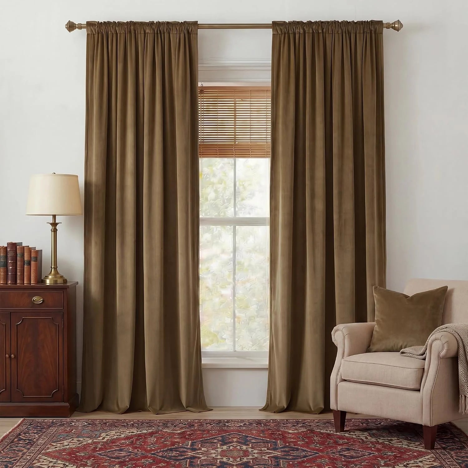 Brown velvet rod pocket curtains framing a window in a warm traditional living room